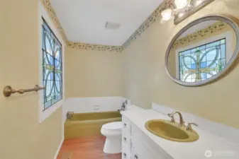 Stained glass bathroom with matching tub/sink