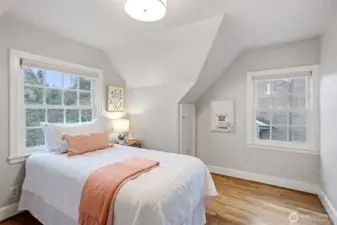The 3rd upstairs bedroom overlooks the beautiful backyard sanctuary and features recently refinished hardwood floors.