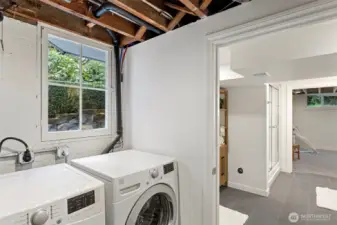 Just outside the lower level bathroom is a mud room and laundry area with a separate entry to outside, this area has a newly tiled floor.