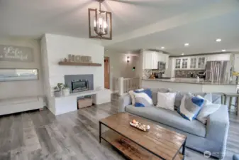 Living area flows to kitchen and dining