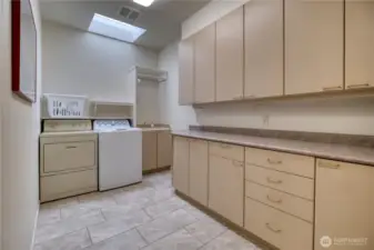 Expansive laundry area with skylight and tons of storage