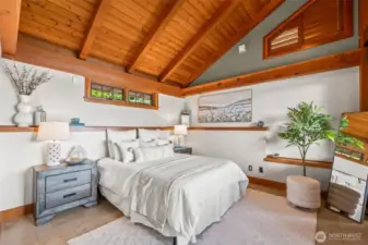 Primary bedroom on main floor.  Car-decking vaulted ceilings are so charming.