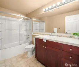 Bathroom at the end of hallway by laundry