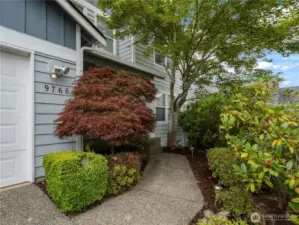 The trees and landscaping offer privacy from the nearby neighbors and street.