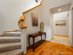 The entryway greets you with soaring ceilings and bright windows.