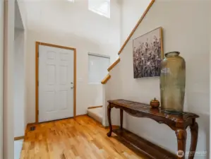 In the main entry, you'll find the bonus room, the stairs leading to the second floor, and the hallway to the main living space.