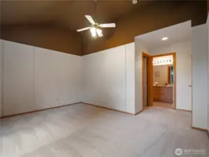 The Primary Bedroom has high ceilings and is also finished with brand-new carpet.