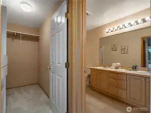 The primary bathroom has large double sinks and lots of space.