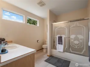 The large upstairs bathroom is very bright and also has new flooring.