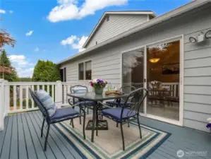 The back deck off the great room has space for entertaining and stairs leading to the yard below.