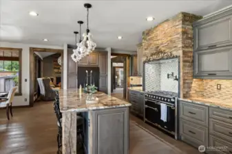 Kitchen with Aga range, pot filler and custom tile.