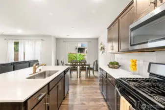 A closer look at the elegant cabinetry, stylish backsplash, and stainless steel finishes that elevate this kitchen’s appeal