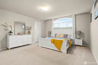 Enjoy the perfect balance of comfort and function in this oversized primary bedroom with room for a full furniture suite and direct ensuite and walk in closet #1 access.