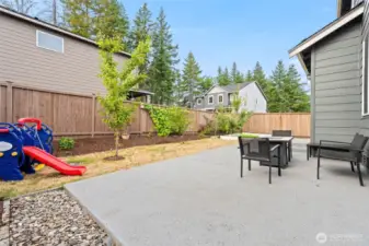 Cement patio is perfect for family gatherings and entertaining, offering a durable and stylish space to enjoy outdoor meals and relax with loved ones.