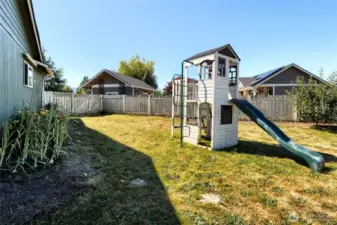 The fenced back yard offers plenty of room to play and enjoy year round.