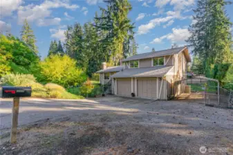 Plenty of parking in the driveway, 2 car-garage, and large space to the right of the driveway.