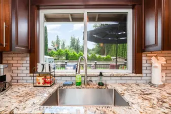Enjoy looking out to your backyard with large window above the sink.