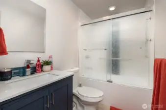 Upstairs full bathroom offers generous space and thoughtful design for a relaxing guest experience.