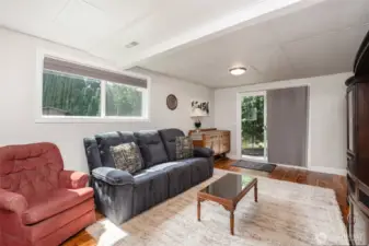 A comfortable living area awaits on the lower level for occasions and casual hangouts.