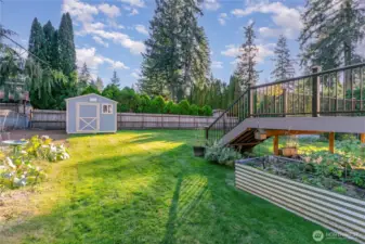 Room for garden space and outdoor shed offers the perfect place to tuck away gardening and yard tools.