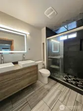 En-suit bathroom with dual rain shower heads and back jets!