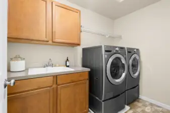 The upstairs utility room makes laundry a breeze - washer and dryer are included!