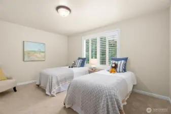 And finally, the 4th bedroom upstairs is also large and features two generous windows and a large closet.