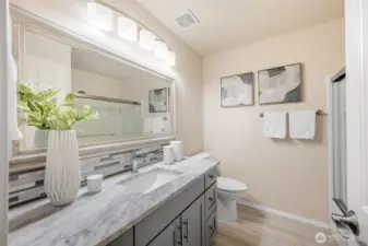 New vanity, countertops, flooring, & shower surround