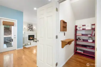Under-stair storage/ walk-in pantry keeps your home organized.