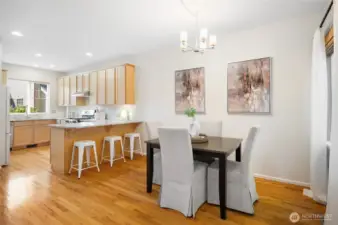 Open kitchen design flows seamlessly into dining area.