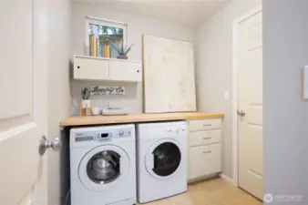 Laundry room with built-in folding table.