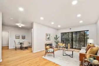 Generous living area with warm, rich hardwood flooring.