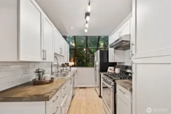 Crisp, updated subway tile backsplash enhances the kitchen design