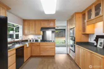 Generous kitchen with loads of cabinet space