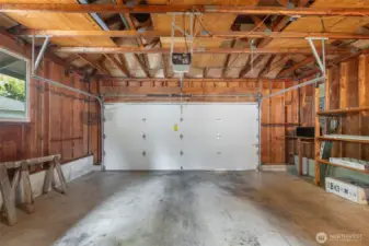 Two car garage with extra space for storage. The utility room is also here.