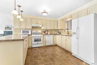 The kitchen has an ample amount of storage.