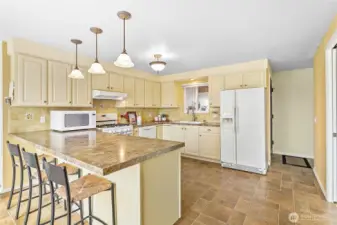 Large countertop area for dining, food preparation, or serving.