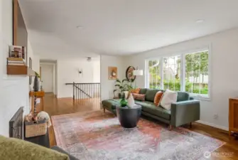 Living looking back towards hallway to some bedrooms and office