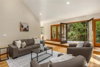 Welcome inside to the living room and entryway, which have impressive vaulted ceilings.