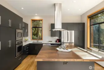 A large central island is great for entertaining. The cabinetry is solid wood with pull-out and soft-closing drawers.