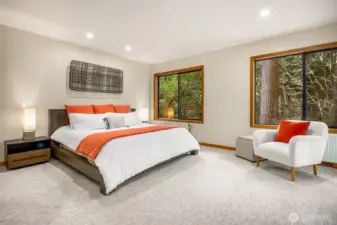 Moving back through the living room over to the bedroom wing of the home and the primary bedroom.