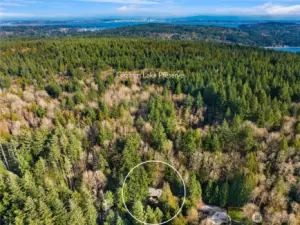 The property backs to the popular Gazzam Lake Nature Preserve to the east and borders a 6-acre Land Trust protected property to the north.