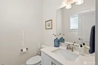 The 1/2 bath on the main floor is down a short hall, perfect for guests.