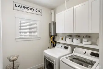 The laundry room is convenient to the kitchen, and hosts the tankless water heater.  A new heat pump with A/C was installed in 2024.