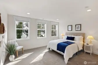 The primary suite has exceptional waterfront views, a beautiful ensuite bath, and a large walk-in closet with custom shelves.