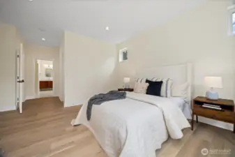 Luxurious primary on the main level offers a very generous walk-in closet and en-suite bath.