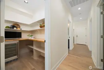 Convenient and spacious walk-in pantry with wine fridge.