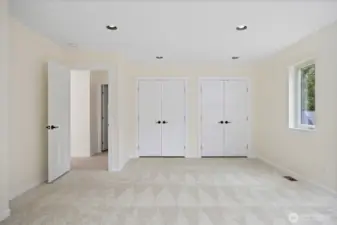 Magnificent guest room with dual closets.