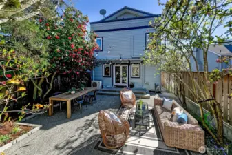 French doors from the dining room open up onto this awesome patio - private, low maintenance,   fully fenced, beautiful and spacious.
