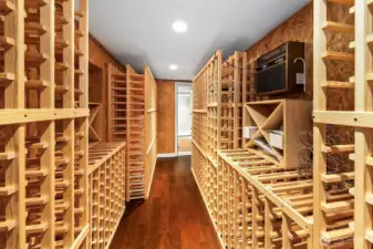Wine cellar includes heat pump for climate control & extensive custom storage rack system.  There's a window that can be exposed if preferred, could become a small bedroom or office with a window.